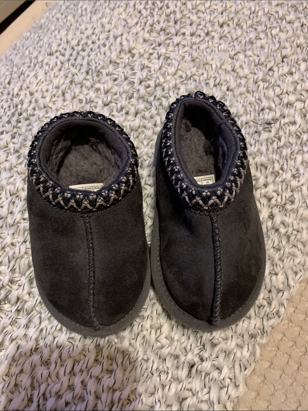 UGG Kids Black Suede Cozy Slip-On Slippers with Braided Trim